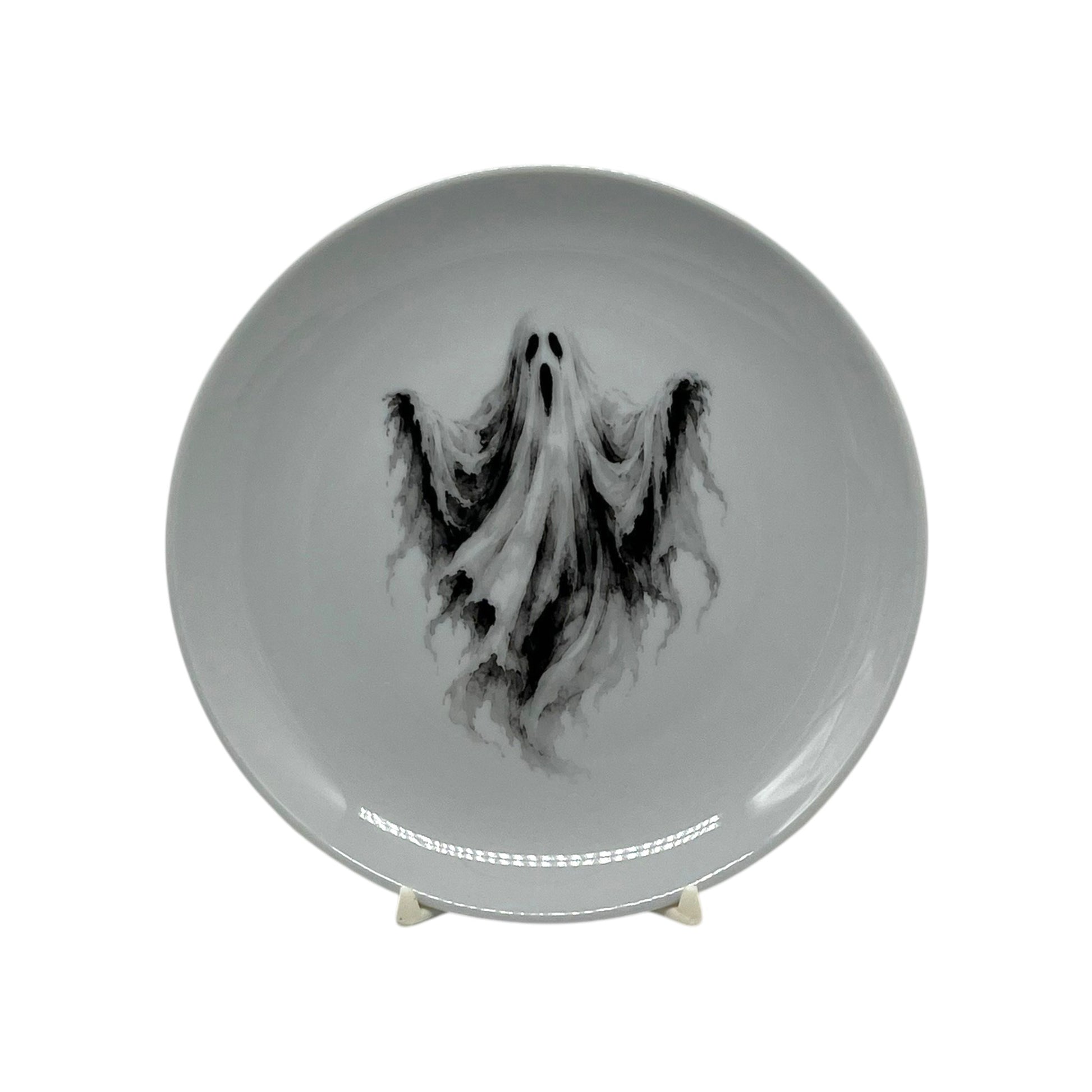 Haunted Spirit 6.25 inch Halloween coupe plate with flowing black-and-white ghost artwork